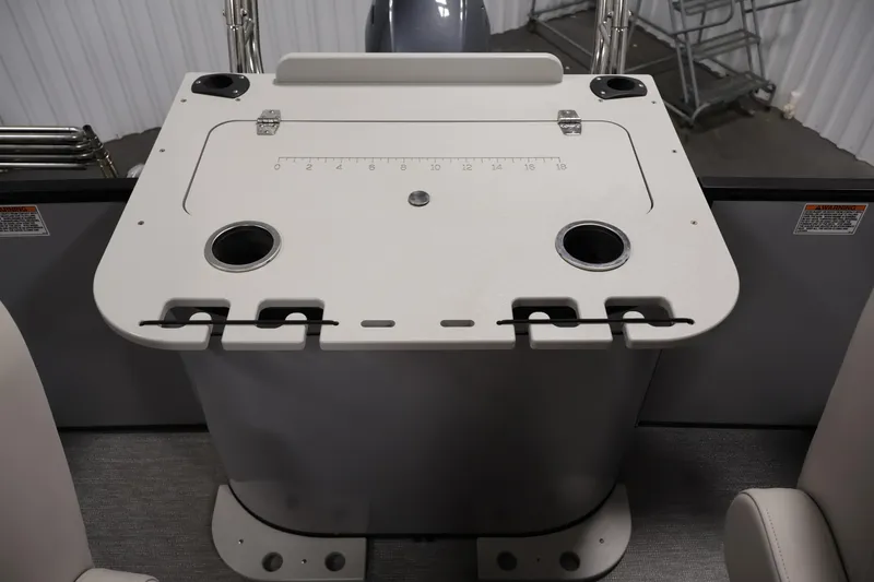 Slide: The Image of 2021 Sylvan 8522 Mirage boat console with cup holders and measurement markings. - 32