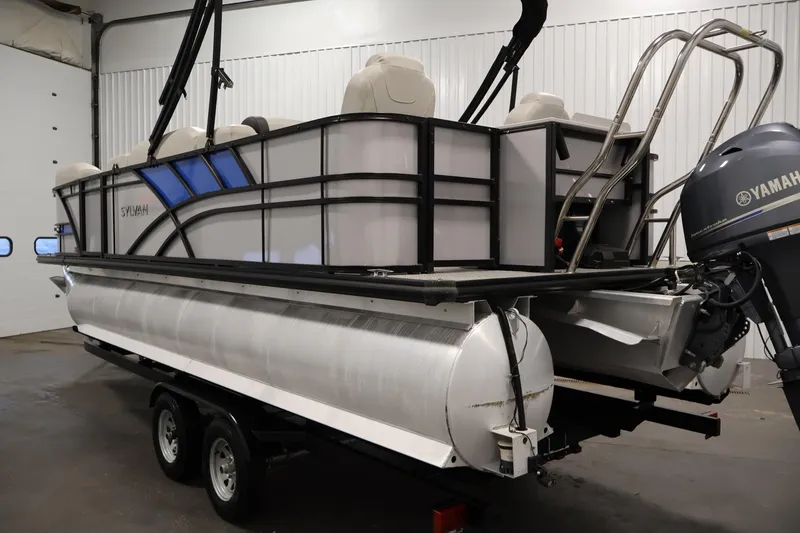 Slide: The Image of 2021 Sylvan 8522 Mirage pontoon boat with Yamaha motor in indoor storage. - 7