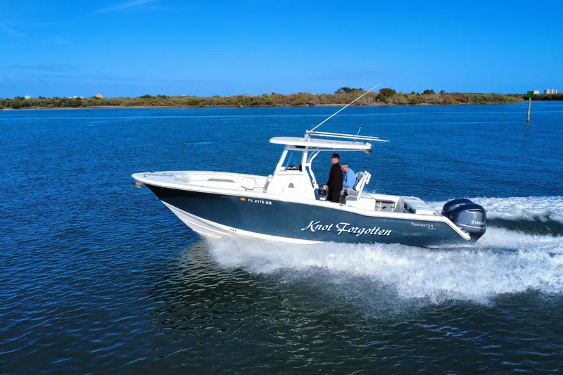 Slide: The Image of 2020 Tidewater 280 CC Adventure boat cruising on a sunny day. - 16