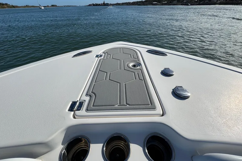 Slide: The Image of 2020 Tidewater 280 CC Adventure boat deck on calm water. - 20