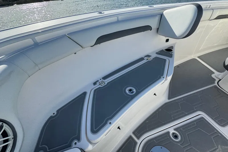 Slide: The Image of 2020 Tidewater 280 CC Adventure boat interior with storage compartments and seating. - 24