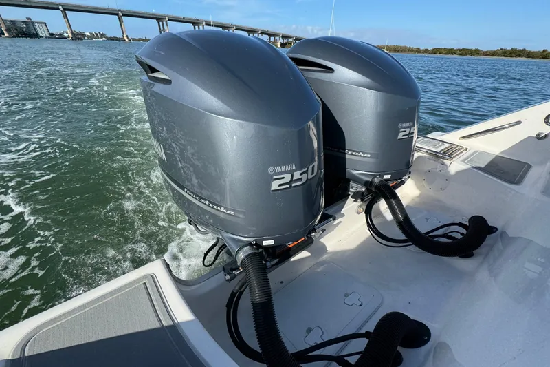 Slide: The Image of 2020 Tidewater 280 CC Adventure with dual Yamaha 250 outboard engines on water. - 33