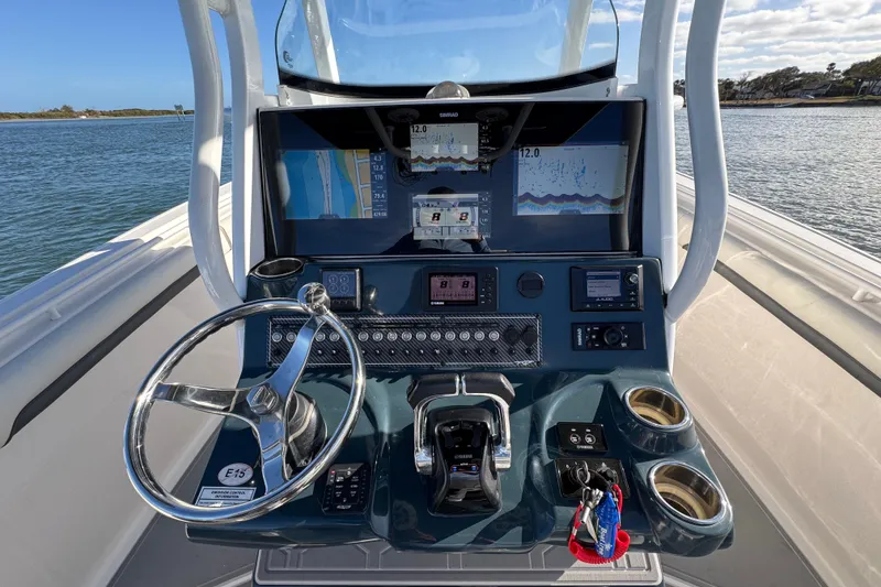 Slide: The Image of 2020 Tidewater 280 CC Adventure boat dashboard with navigation and control systems. - 36