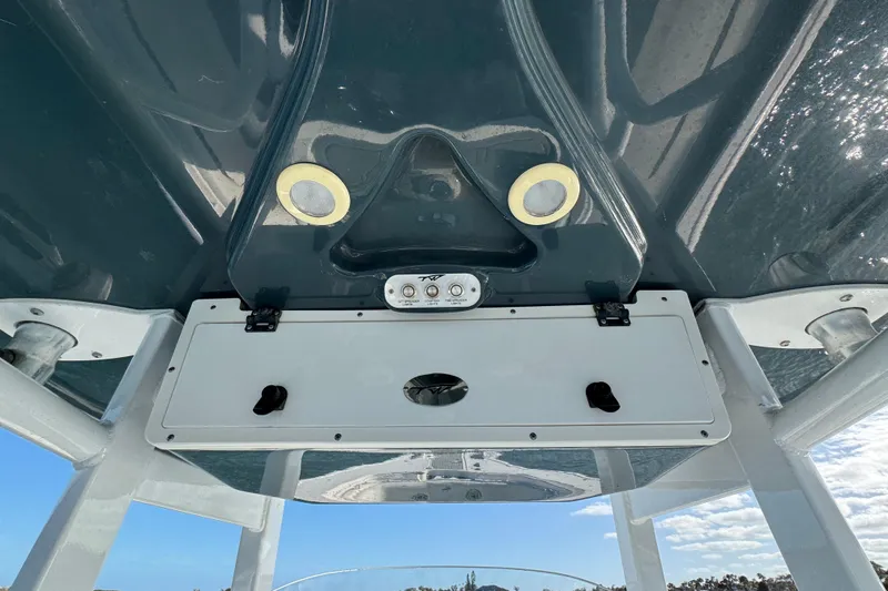 Slide: The Image of 2020 Tidewater 280 CC Adventure boat console with overhead storage and lighting. - 39