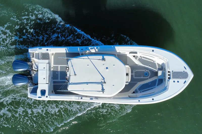 Slide: The Image of Aerial view of 2020 Tidewater 280 CC Adventure boat cruising on water. - 4