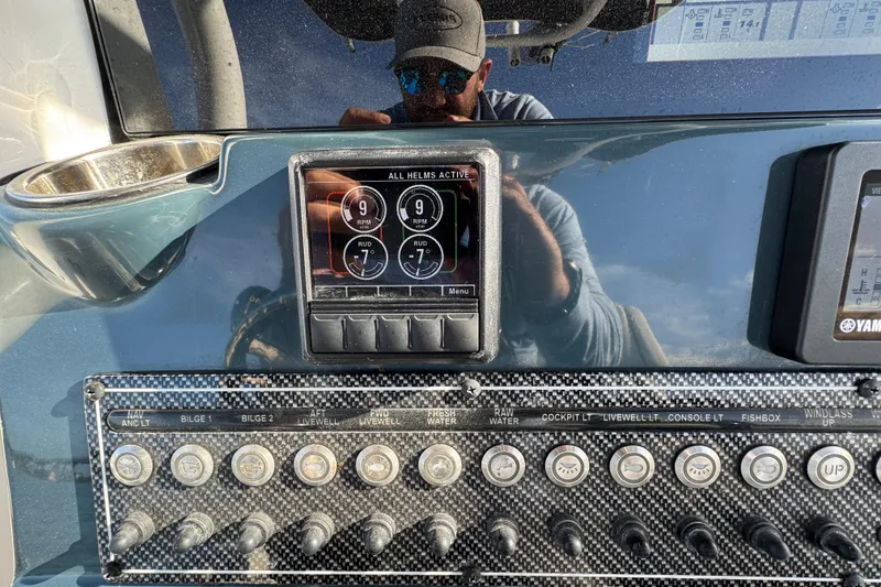 Slide: The Image of Dashboard of 2020 Tidewater 280 CC Adventure boat with control panel and gauges. - 41