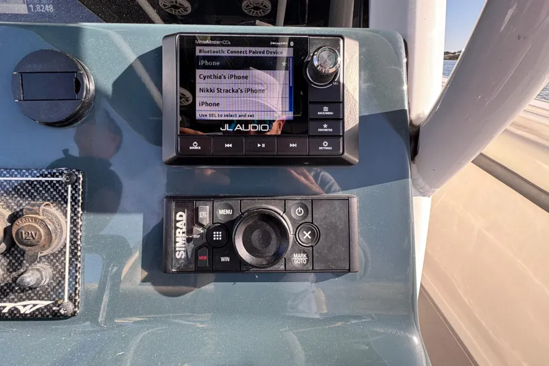 Slide: The Image of Control panel of 2020 Tidewater 280 CC Adventure boat with JL Audio and Simrad systems. - 42