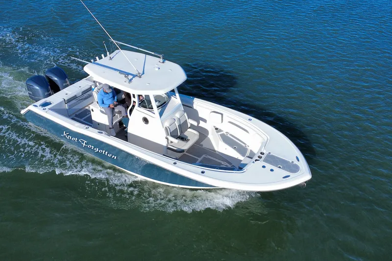 Slide: The Image of 2020 Tidewater 280 CC Adventure boat cruising on open water. - 5