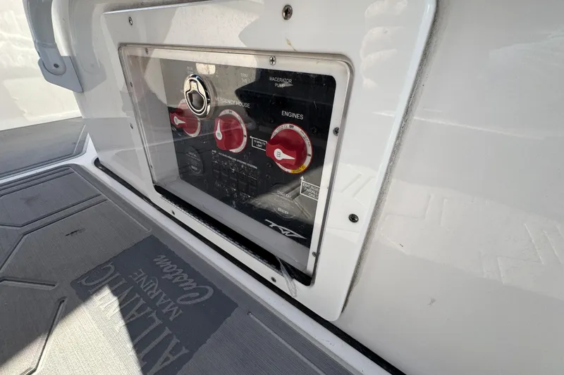 Slide: The Image of Control panel on a 2020 Tidewater 280 CC Adventure boat, featuring engine switches. - 50