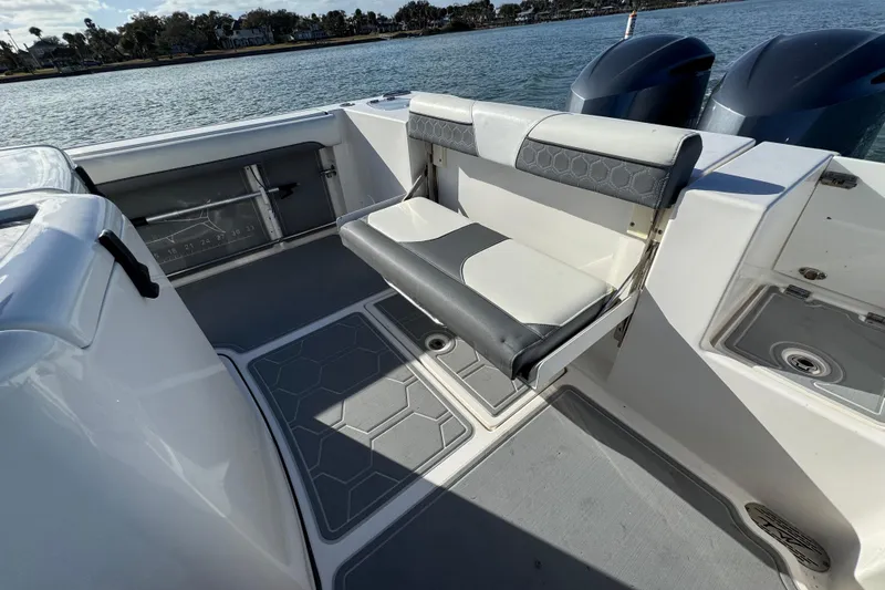 Slide: The Image of 2020 Tidewater 280 CC Adventure boat interior with foldable seating and dual engines. - 54