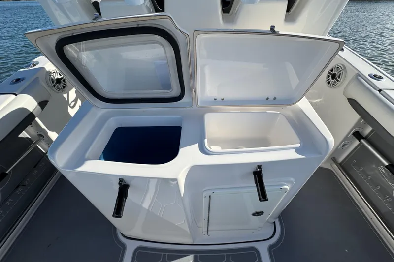Slide: The Image of Tidewater 280 CC Adventure 2020 boat with open storage compartments on deck. - 55