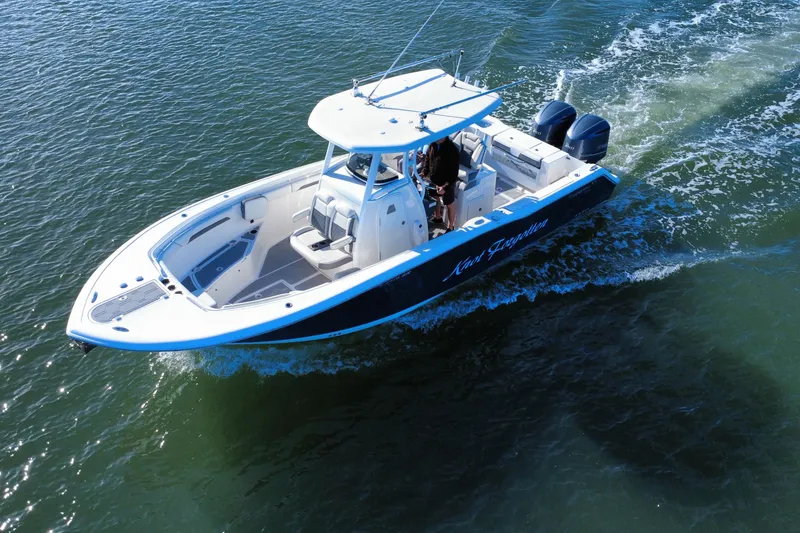 Slide: The Image of 2020 Tidewater 280 CC Adventure boat cruising on open water. - 6