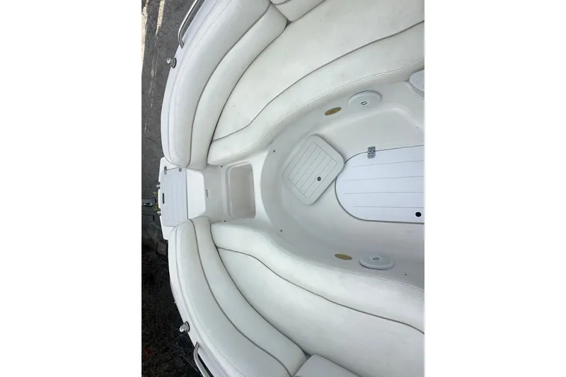 Slide: The Image of Interior of 2004 Vectra S-215 boat with white cushioned seating. - 15