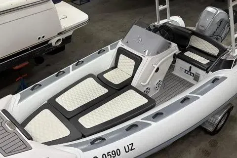 Slide: The Image of 2024 Highfield Sport 520 boat with sleek design and comfortable seating. - 0