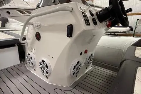 Slide: The Image of 2024 Highfield Sport 520 boat console with steering wheel and speaker system. - 10