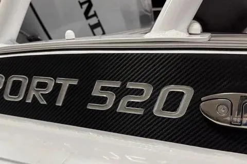 Slide: The Image of 2024 Highfield Sport 520 boat model nameplate with sleek design details. - 2