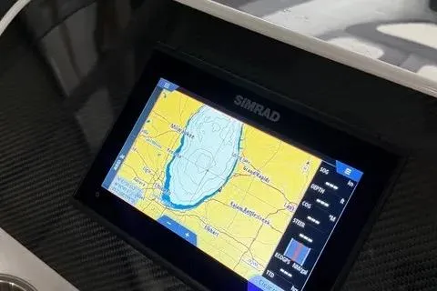 Slide: The Image of Simrad navigation display on 2024 Highfield Sport 520 boat dashboard. - 6