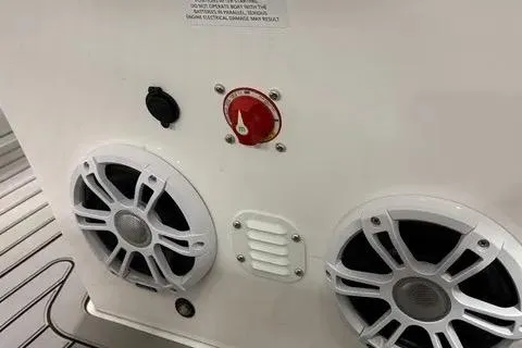 Slide: The Image of 2024 Highfield Sport 520 boat speakers and control panel close-up. - 8