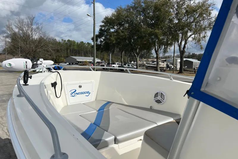 Slide: The Image of 2011 Renegade OF 23 boat interior with seating and equipment, parked outdoors. - 11