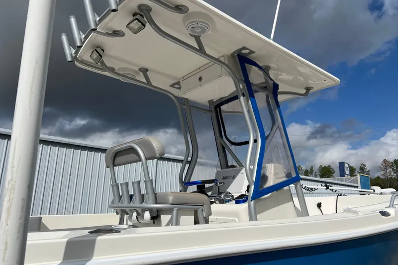 Slide: The Image of Renegade OF 23 boat, 2011 model, featuring a sturdy T-top and modern console design. - 16