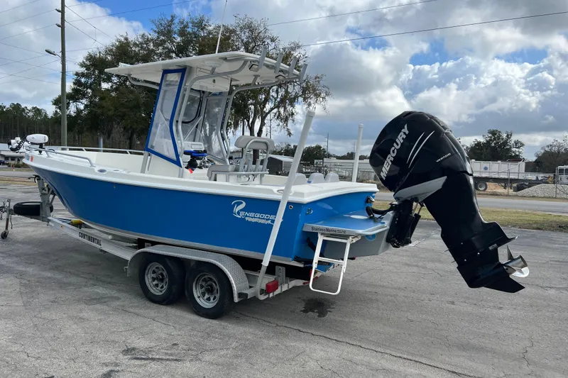 Slide: The Image of 2011 Renegade OF 23 boat on trailer with Mercury outboard motor. - 6