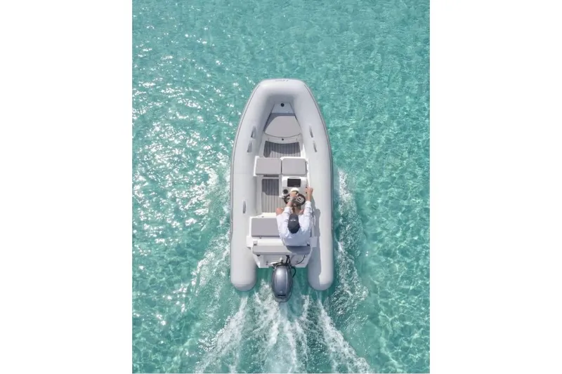 Slide: The Image of AB Inflatables Mares 12 VSX 2026 on clear water. - 10