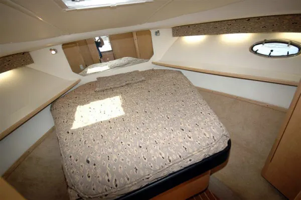 Slide: The Image of Interior of 2002 Tiara Yachts 3500 Open with cozy bed. - 19