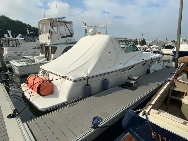 Slide: The Image of 2002 Tiara Yachts 3500 Open at dock, covered. - 23