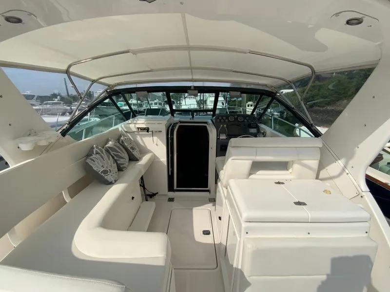 Slide: The Image of Interior of a 2002 Tiara Yachts 3500 Open, featuring seating and helm station. - 27