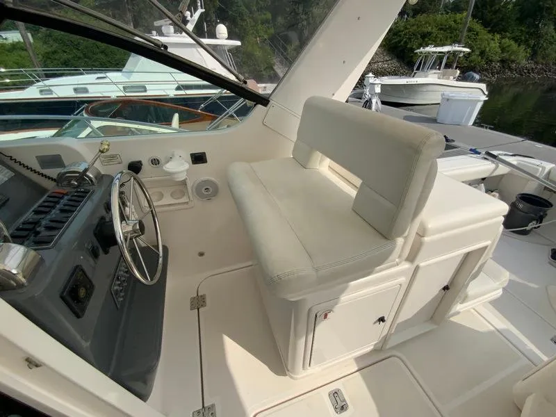 Slide: The Image of Interior of a 2002 Tiara Yachts 3500 Open, helm and seating area. - 29