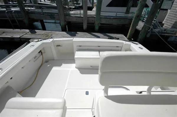 Slide: The Image of Interior of a 2002 Tiara Yachts 3500 Open, featuring white seating area. - 3