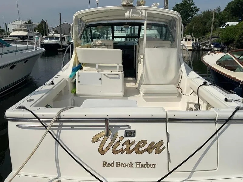 Slide: The Image of 2002 Tiara Yachts 3500 Open at harbor, rear view of boat. - 32