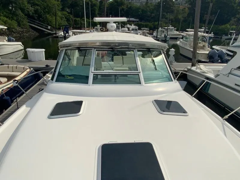 Slide: The Image of 2002 Tiara Yachts 3500 Open docked, front view. - 36