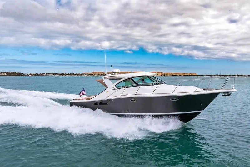 Slide: The Image of 2013 Tiara Yachts 3600 Coronet cruising on open water under cloudy skies. - 0
