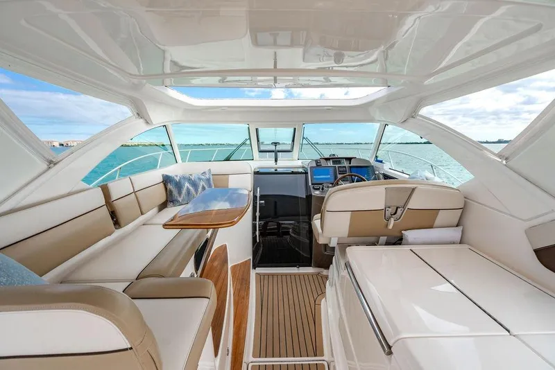 Slide: The Image of Luxurious interior of 2013 Tiara Yachts 3600 Coronet, featuring elegant seating and ocean view. - 2