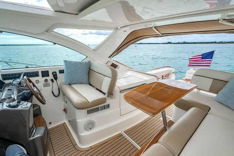 Slide: The Image of Luxurious 2013 Tiara Yachts 3600 Coronet interior with seating, table, and ocean view. - 24