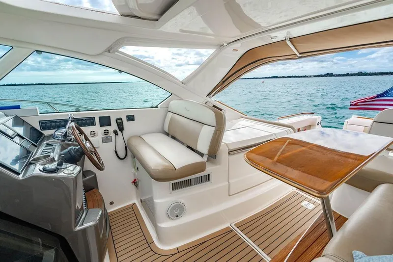 Slide: The Image of Luxurious 2013 Tiara Yachts 3600 Coronet interior with ocean view and American flag. - 25