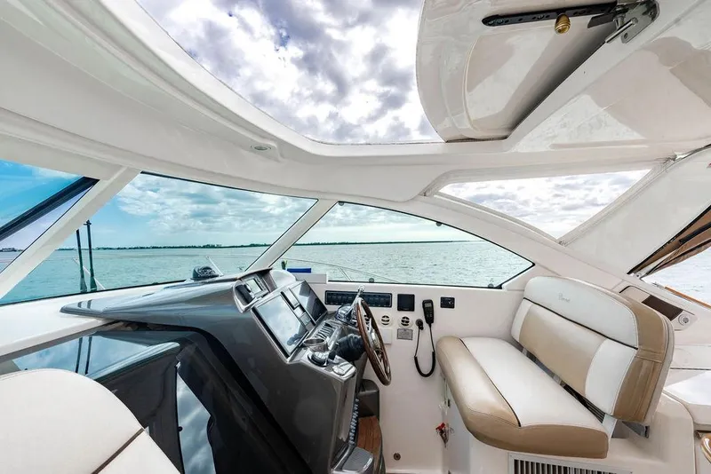 Slide: The Image of Interior view of 2013 Tiara Yachts 3600 Coronet, featuring helm and seating area. - 26