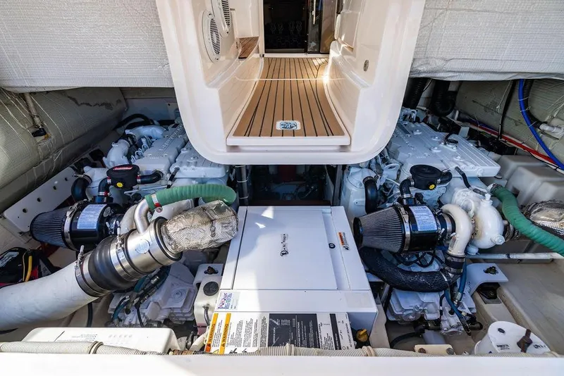 Slide: The Image of Engine room of 2013 Tiara Yachts 3600 Coronet, showcasing dual engines and equipment. - 32