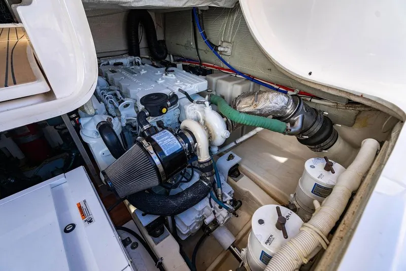 Slide: The Image of Engine compartment of 2013 Tiara Yachts 3600 Coronet, showcasing detailed mechanical components. - 33
