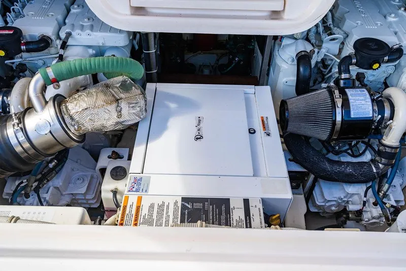 Slide: The Image of Engine compartment of a 2013 Tiara Yachts 3600 Coronet, showcasing mechanical components. - 35