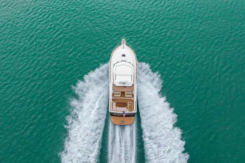 Slide: The Image of Aerial view of 2013 Tiara Yachts 3600 Coronet cruising on turquoise water. - 43