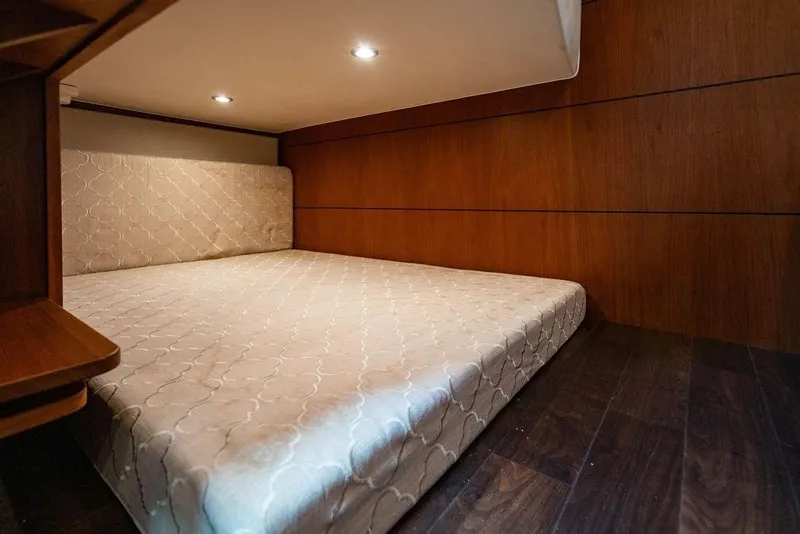 Slide: The Image of Luxurious cabin interior of 2013 Tiara Yachts 3600 Coronet with elegant wood paneling. - 8