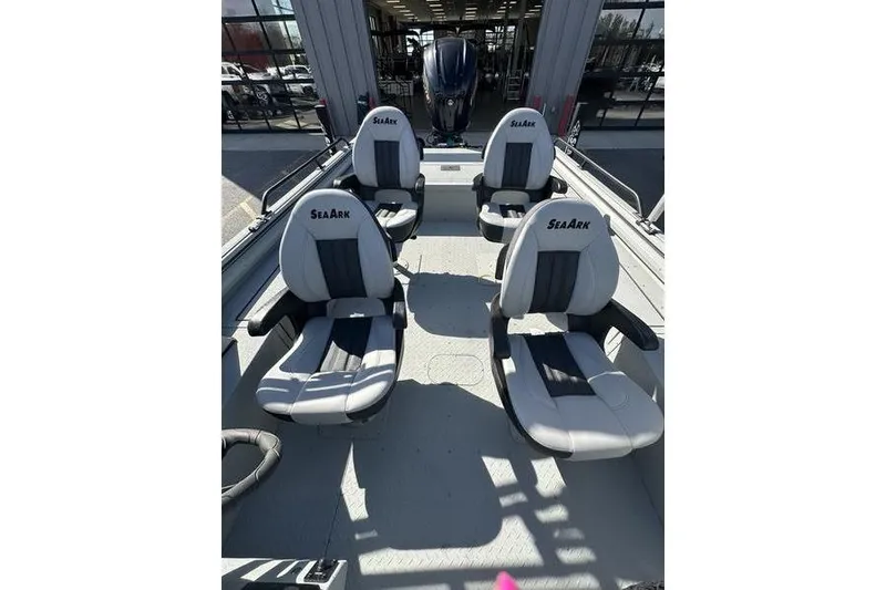 Slide: The Image of 2025 SeaArk ProCat 240 boat interior with four cushioned seats. - 11