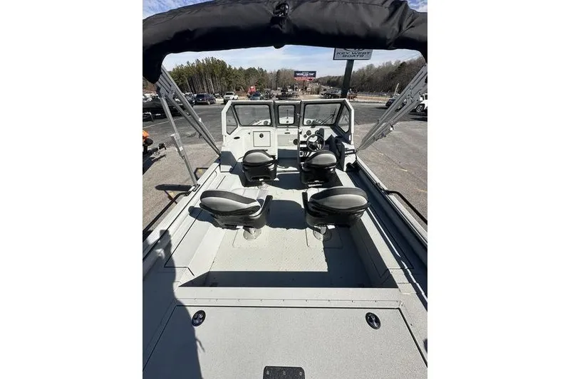 Slide: The Image of 2025 SeaArk ProCat 240 boat interior with four seats and steering console. - 8