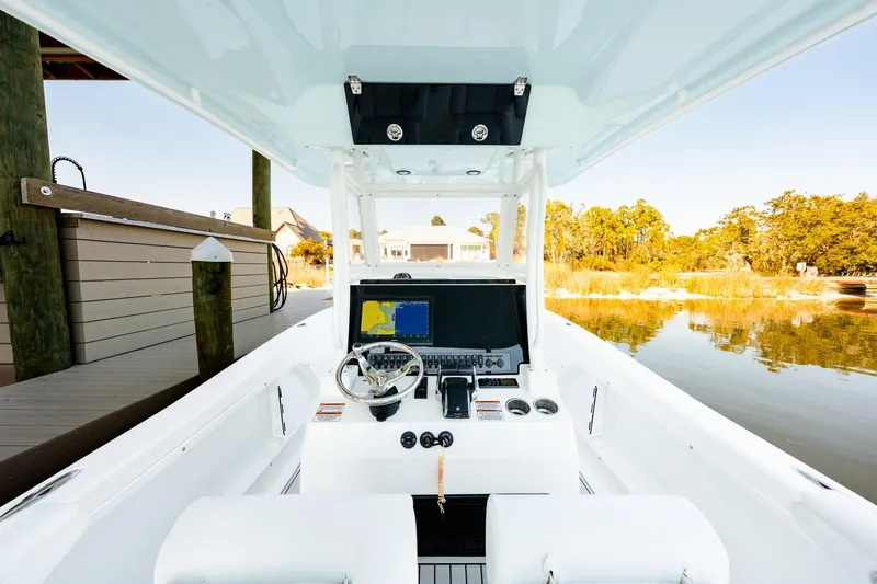 Slide: The Image of 2023 Twin Vee 260 GFX CC boat interior with steering console and navigation system. - 39