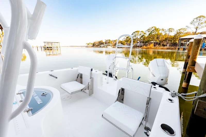 Slide: The Image of 2023 Twin Vee 260 GFX CC boat interior with serene waterfront view. - 42