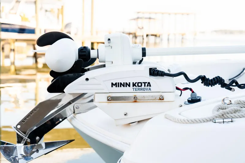 Slide: The Image of Minn Kota Terrova motor on 2023 Twin Vee 260 GFX CC boat, docked by water. - 46