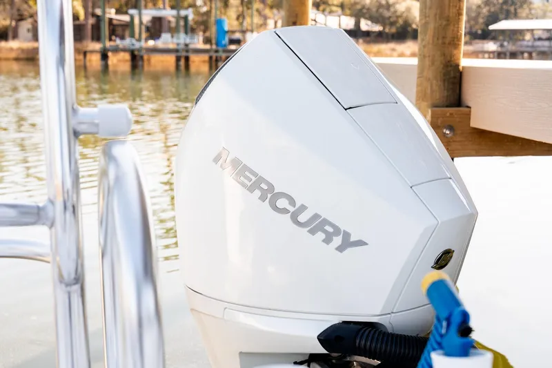 Slide: The Image of 2023 Twin Vee 260 GFX CC with Mercury outboard engine by a dock. - 49