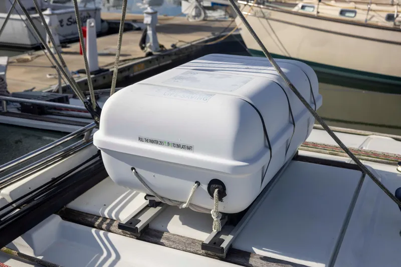 Slide: The Image of Life raft on Jeanneau Sun Odyssey 43 DS, 2001 model, docked at marina. - 11